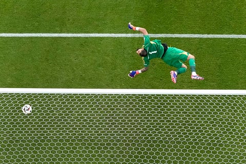 Italy's goalkeeper Gianluigi Donnarumma fails to safe a shot